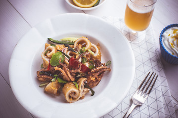 Fried Squid Calamari with Chili Pepper in Rustic White Plate