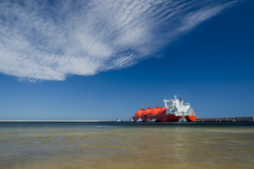 LNG RED TANKER - A giant ship moored to the gas terminal in Swinoujscie
