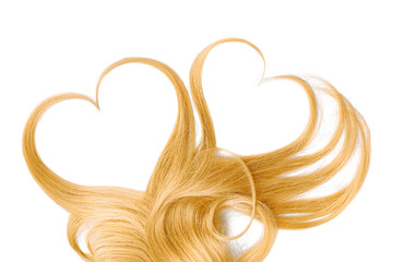 Blond hair isolated on white background. Heart shape