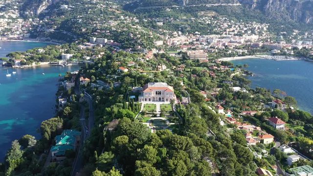 Aerial back traveling over Saint Jean Cap Ferrat south of France amazing paradise mediterranean residential area. Sunny morning