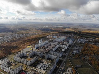 The aerial view of the frowning clouds and the Golden autumn city,created by dji camera