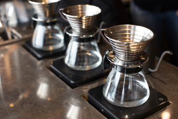 A coffee dripper and glass pot isolated