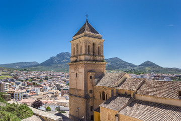 Fototapeta na wymiar Church tower and surrounding landscape of Alcaudete, Spain