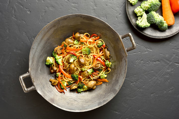 Udon stir-fry noodles with vegetables in wok