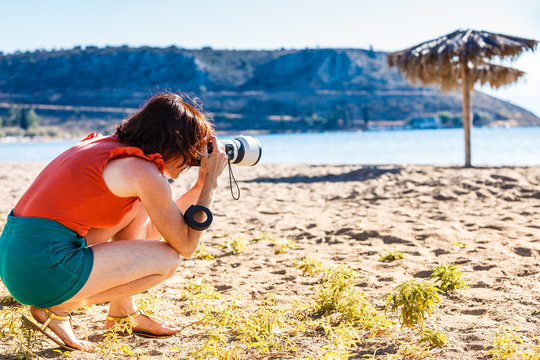 Woman taking pictures during holiday in Greece