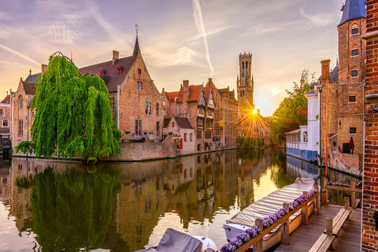 Classic view of the historic city center of Bruges (Brugge), West Flanders province, Belgium. Sunset cityscape of Bruges.
