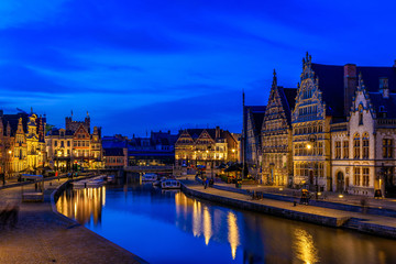 Fototapeta na wymiar View of Graslei, Korenlei quays and Leie river in the historic city center in Ghent (Gent), Belgium. Architecture and landmark of Ghent. Night cityscape of Ghent.