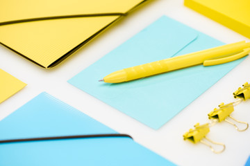 blue and yellow stationery on white background