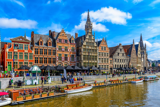 View of Graslei quay and Leie river in the historic city center in Ghent (Gent), Belgium. Architecture and landmark of Ghent. Cityscape of Ghent.