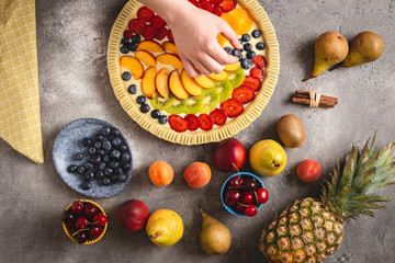 Female Hands Prepare Tart Pie with Fresh Dough and Colorful Fruits