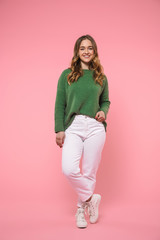 Full length image of Happy woman wearing in green sweater