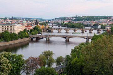 Fototapeta na wymiar Bridges of Prague over Vltava River at dusk. Scenic view from Letna Hill in Prague, Czech Republic