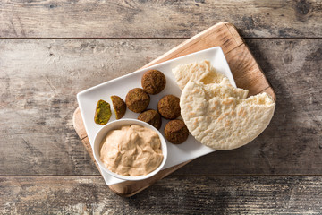 Falafel on a plate on wooden table