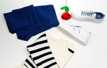 woman collection: blue jean and white sneakers with blue shoelaces and zebra woolen sweater