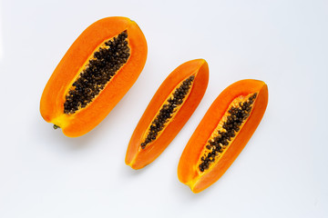 Ripe papaya fruit on white background.
