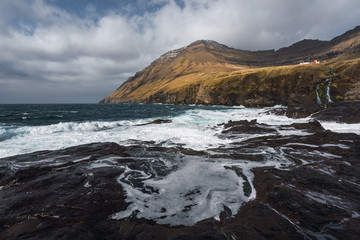 Foamy waves near shore on cloudy day