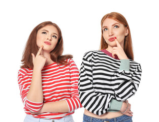 Portrait of thoughtful young women on white background