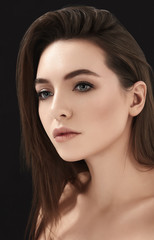 Sensual brunette with makeup in close-up