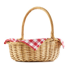 Fototapeta na wymiar Empty wicker basket with red checkered tablecloth for picnic.