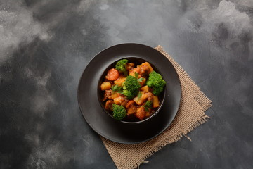 Traditional homemade Hungarian beef meat stew, Goulash with potatoes, carrots , tomatoes, broccoli in a bowl