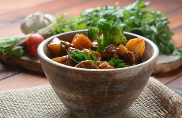 Traditional homemade Hungarian beef meat stew, Goulash with potatoes, carrots , tomatoes, broccoli in a bowl