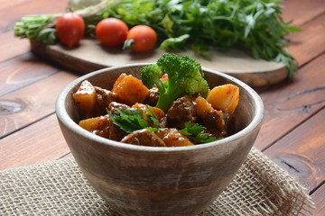 Traditional homemade Hungarian beef meat stew, Goulash with potatoes, carrots , tomatoes, broccoli in a bowl