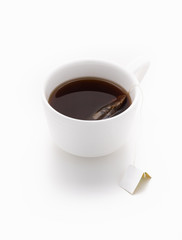 black tea in white cup on isolated white background