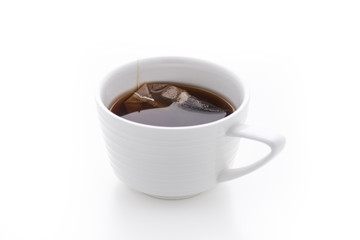black tea in white cup on isolated white background