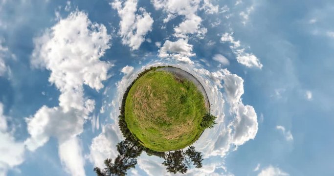 NO VR. Curvature of space of little planet transformation. Abstract torsion and spinning of full flyby panorama landscape on gravel road in sunny day with awesome clouds.