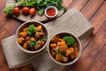Traditional homemade Hungarian beef meat stew, Goulash with potatoes, carrots , tomatoes, broccoli in a bowl