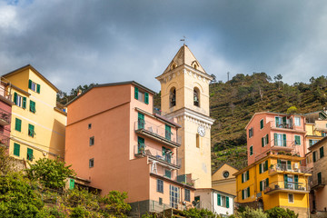 Fototapeta premium Historic building with bell tower in Manarola, the Cinque Terre towns, Italy.