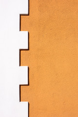 Eine weiß braune Mauer mit Muster als Hintergrund