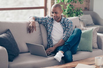 Portrait of positive cheerful satisfied man student have modern technology use user dressed denim...