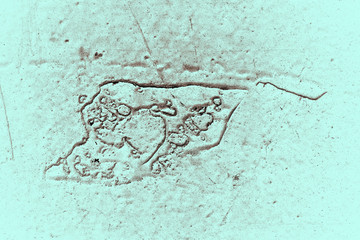 Vintage cyan background. Rough painted wall of hazel color. Imperfect plane of brown colored. Uneven old decorative toned backdrop of blue tint. Texture of azure hue. Ornamental stony surface.