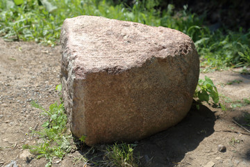 Untreated rough natural gray stone in everyday environment