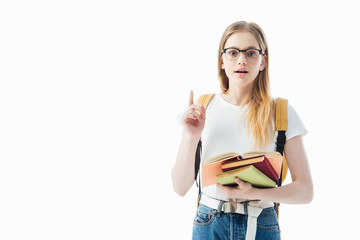 excited schoolgirl with books and backpack showing idea gesture isolated on white