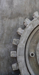 Big statue gear on cement wall