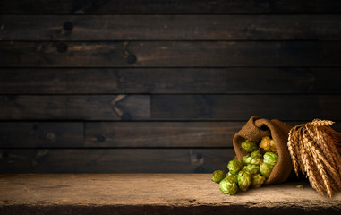 Still life with a keg of beer and hops.