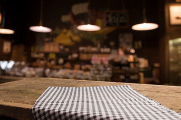 Table background with napkin and blurred bar background space