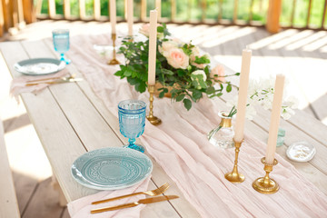 Beautiful festive table setting with elegant white flowers and cutlery, dinner table decoration.
