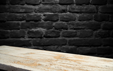 image of wooden table in front of abstract blurred background of resturant lights