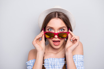 Portrait of crazy cute astonished youth people touch specs shout scream wow incredible information black friday she wears her shirt plaid fashionable impressed isolated grey argent background