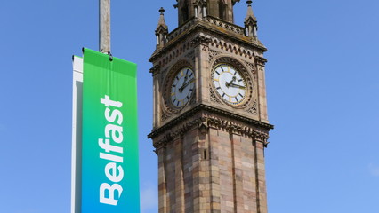 The Albert Memorial Clock Tower with a colorful advertising sign for the promotion of tourism in...