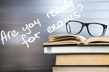 Books and glasses on  table  background,close up
