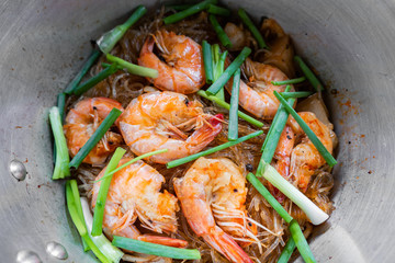 Baked shrimp and vermicelli or casserole shrimps on pot.
