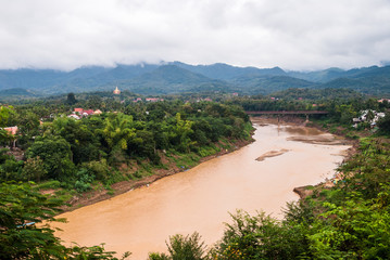 View of the city of Luang Prabang in Laos, with the Mekong River, cloudy day with many clouds