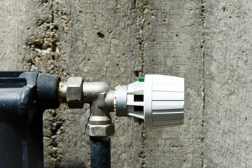 Heating thermostat on the concrete background