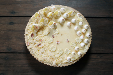 White chocolate tart on woden background