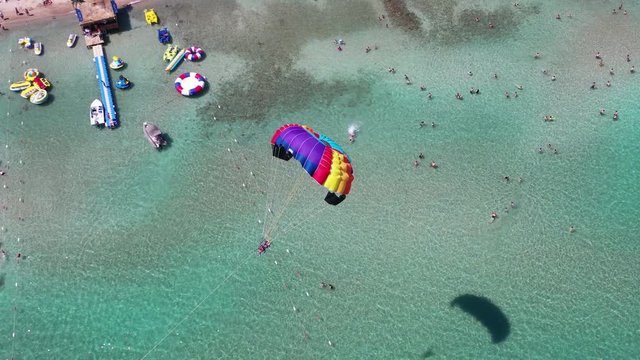 Wonderful flight parasailing over azure waters