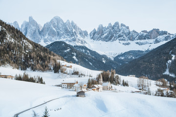 Fototapeta na wymiar Dolomites mountain peaks with Val di Funes village in winter, South Tyrol, Italy